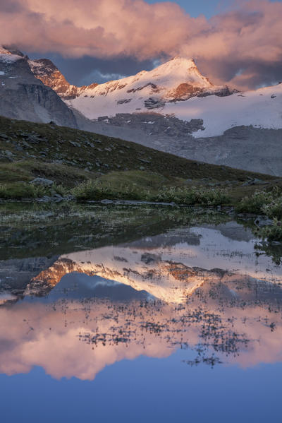 Punta Tresenta reflected in an alpine lake at sunset, Valsavarenche, Aosta Valley, Italy