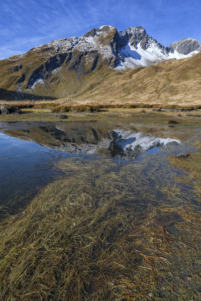 Lancebranlette reflected in Lake Verney at the Little St. Bernard Pass, La Thuile, Aosta Valley, Italy
