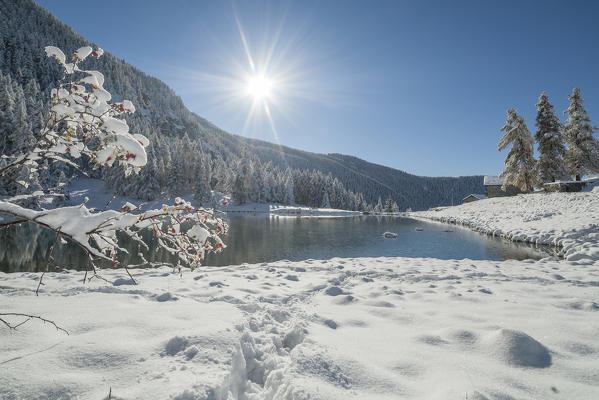 Snowy Croux Lake in autumn, La Magdeleine, Aosta Valley, Italy