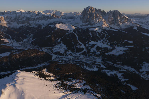 Aerial view over the Val Gardena, Langkofel and Sella group. Dolomites, Bolzano province, Trentino Alto-Adige region. Italy, Europe