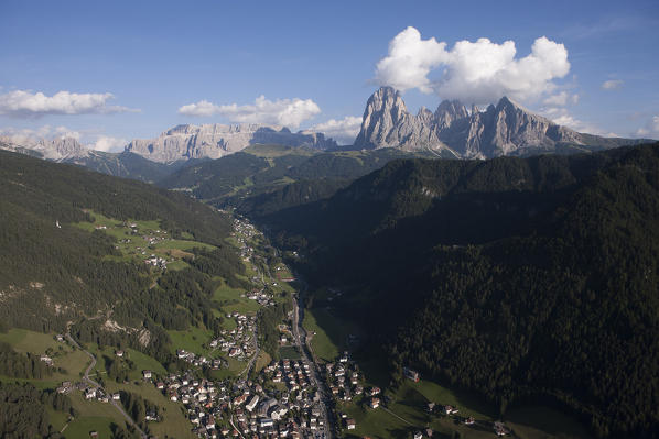 Aerial view over Val Gardena and Sassolungo group. Dolomites,  Bolzano province, Trentino Alto-Adige region. Italy, Europe