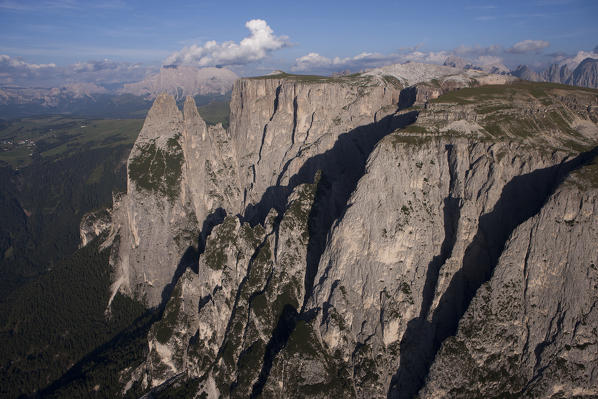 Aerial view of The Schlern mountain, the Santner peak on the left. On background the Seiser Alm and the Langkofel groups. Dolomites, Bolzano province, Trentino Alto-Adige region. Italy, Europe