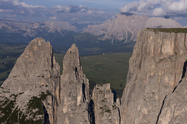Aerial view of The Schlern mountain, the Santner peak on the left. On background the Seiser Alm and the Langkofel groups. Dolomites, Bolzano province, Trentino Alto-Adige region. Italy, Europe