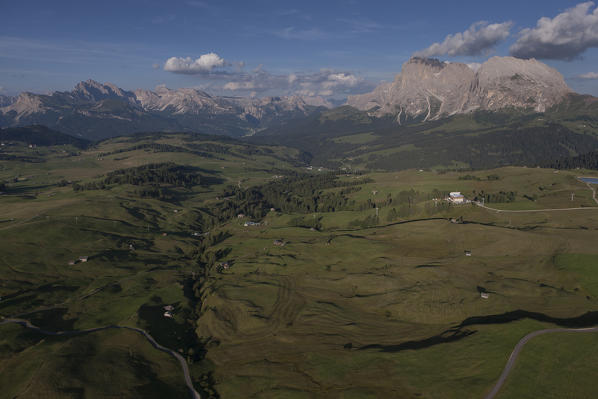Aerial view of the Seiser Alm, the largest high altitude Alpine meadow in Europe. On background, the Langkofel group. Dolomites, Bolzano province, Trentino Alto-Adige region. Italy, Europe