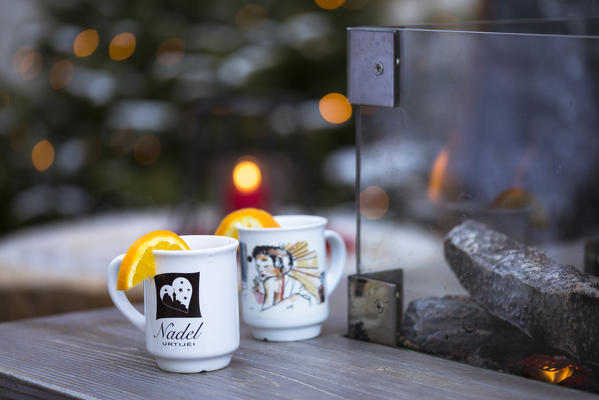 a detail of two cups of mulled wine into the Christmas Market, Bolzano province, South Tyrol, Trentino Alto Adige, Italy