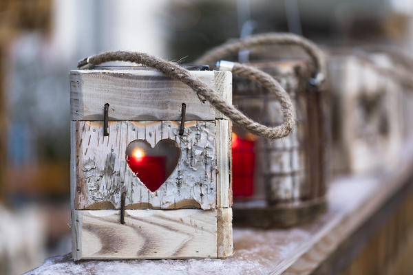 a detail of a traditional wood outdoor decoration with a candle inside, Bolzano province, south tyrol, trentino alto adige, italy