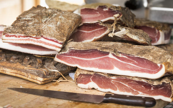 a detail of the famous Speck, a typical south tyrolean food, Bolzano province, South Tyrol, Trentino Alto Adige, Italy