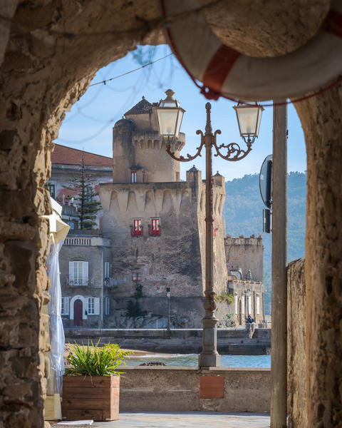 Torre Perrotti from the arcades of a restaurant in Santa Maria di Castellabate, Salerno, Campania, Italy, Europe