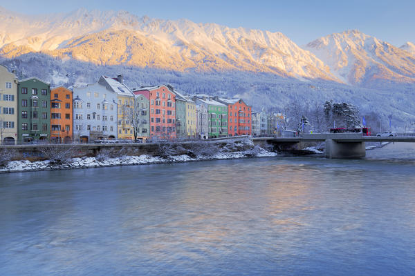 A winter dawn at Marktplatz with the buildings of Mariahilf and the Nordkette mountains in the background Tyrol, Austria, Europe