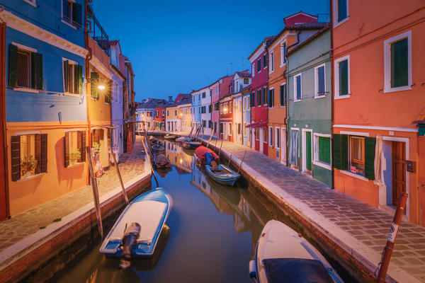 One of the typical canals of the island of Burano at evening, Laguna di Venezia, Venice, Veneto, Italy, Europe