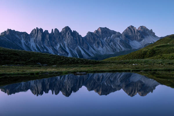 Kalkkögel mountain chain reflecting itself in the little Salfeiner See at early morning, Grinzens, Innsbruck Land, Tyrol, Austria, Europe