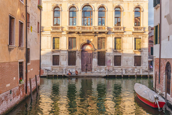 Tourists taking a break in front of Palazzo Diedo, Venice, Veneto, Italy, Europe