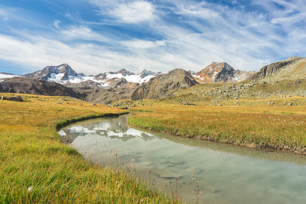 The Peaks at the end of Stubai Valley reflecting in a wild stream, Innsbruck Land, Tyrol, Austria, Europe