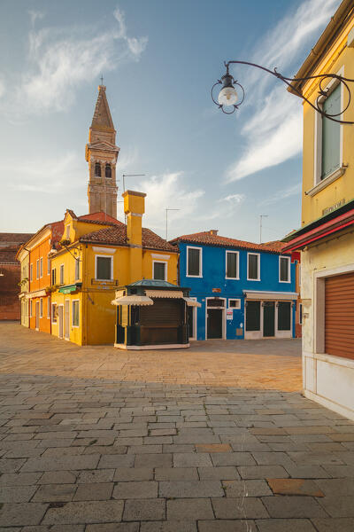 The iconic leaning bell-tower of Burano at dawn, Venice, Veneto, Italy, Europe