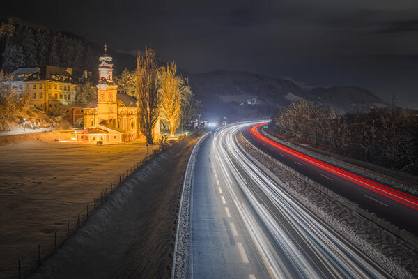 The Inn Valley Highway by the Karlskirche on a winter night, Volders, Hall-Wattens region, Innsbruck Land, Tyrol, Austria, Europe