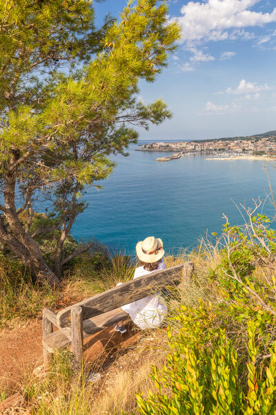 A woman admiring the bay of Lentiscelle, Marina di Camerota, Salerno province, Campania region, Italy, Europe