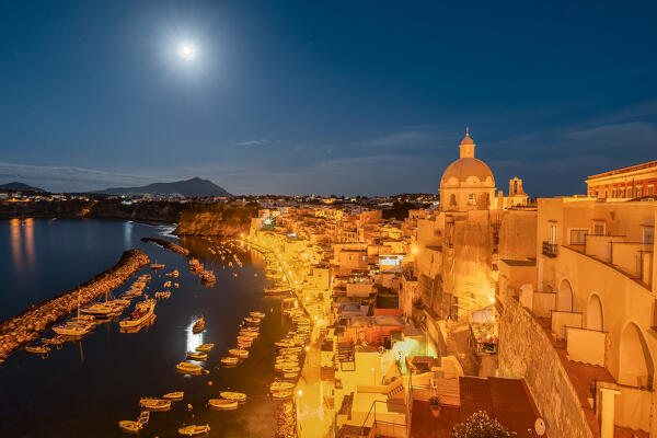 The famous Marina di Corricella on an early morning with the moonlight, Procida Island, Campania region, Italy, Europe