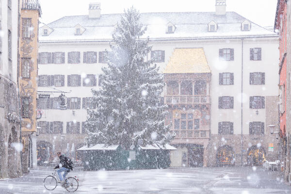 Bike riding in the snowy old town of Innsbruck, Tyrol, Austria, Europe