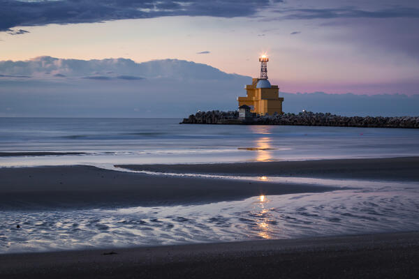 The beach of Punta Sabbioni with its lighthouse after a stormy night, Cavallino Treporti, Venice, Veneto, Italy, Europe