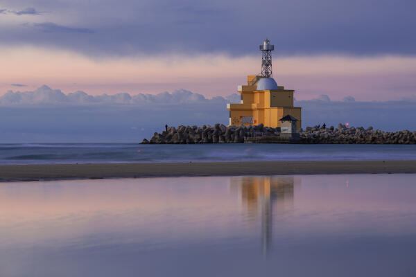 Dawn by the lighthouse of Punta Sabbioni with its usual fishermen, Punta Sabbioni, Venice, Veneto, Italy, Europe