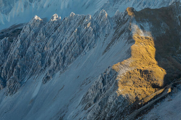 The sun begins to warm the typical rock formations of Karwendel mountains, Mandlkar, Hafelekar cable car station, Innsbruck, Innsbruck Stadt, Tyrol, Austria, Europe