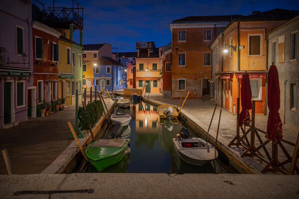 View of Fondamenta San Mauro at night as seen from one of the typical marble bridges of the island, Burano, Venice, Veneto, Italy, Europe