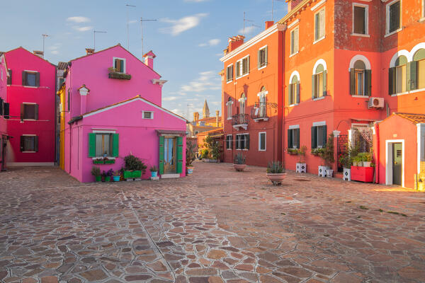 A purple house and other painted buildings typical in the island of Burano, Venice, Veneto, Italy, Europe