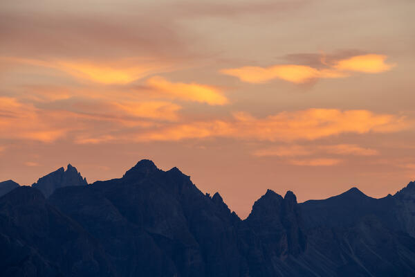 The unique mountain skyline at dusk including the peaks of Pflerscher Tribulaun and Kirchdachspitze as seen from the Seegrube in Innsbruck, Nordkette, Tyrol, Austria, Europe