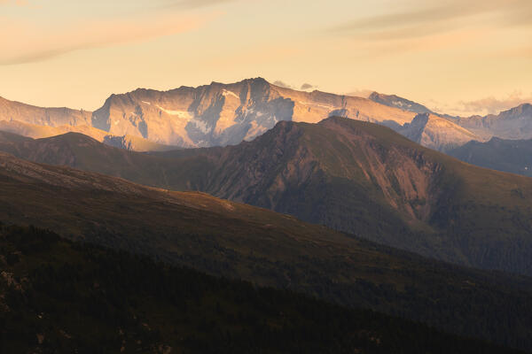 The last sunrays hitting the rock formation of Kraxenträger mountain at the border between Austria and Italy, as seen from the Seegrube in Innsbruck, Nordkette, Tyrol, Austria, Europe