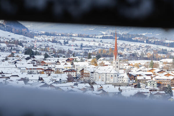 The sun hitting the charming village of Axams after the snowfall on a winter day, Axams, Westliches Mittelgebirge, Innsbruck Land, Tyrol, Austria, Europe