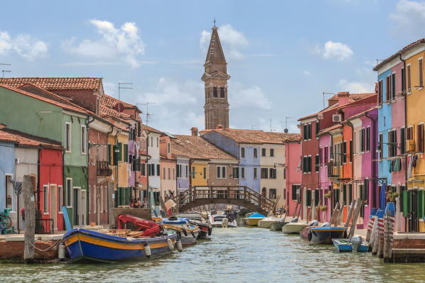 The bell tower and the colourful houses of Burano seen from the waterbus, Burano, Venice, Veneto, Italy, Europe