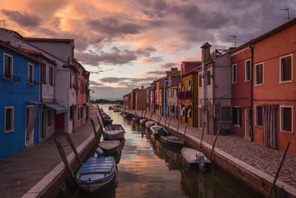 A canal of Burano at sunset, Venice, Veneto, Italy, Europe