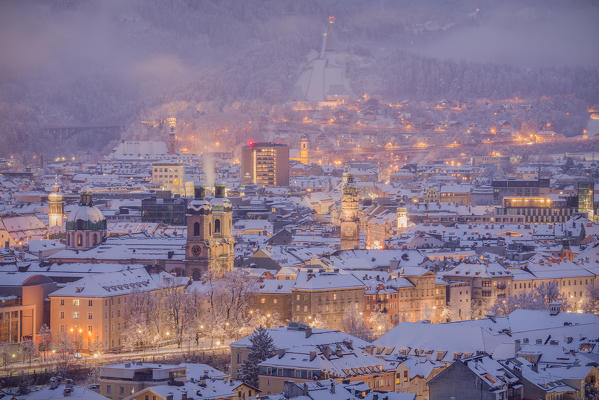 The view over the snowy rofftops of Innsbruck from the Höhenstraße, Innsbruck ,Tyrol, Austria, Europe