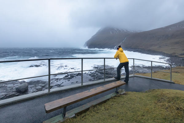 A man is looking the coastal storm in Gjogv (Eysturoy island, Faroe Islands, Denmark) (MR)