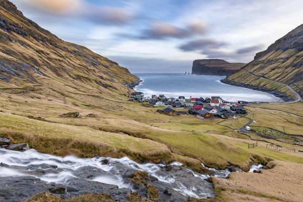 The cove of Tjornuvik and in background near the cliff the two sea stacks of Risin and Kellingin (Streymoy island, Faroe Islands, Denmark)