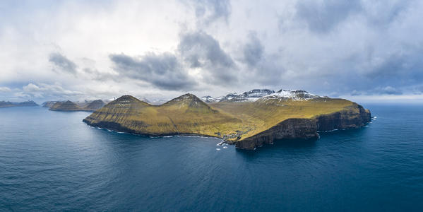 Aerial panoramic view of Eysturoy island from the sea in front of Gjogv village (Faroe Islands, Denmark)