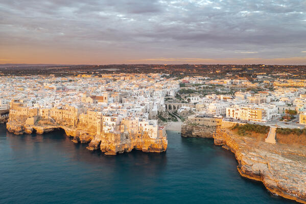 Aerail view of Polignano a Mare during a summer sunrise (province of Bari, Apulia, Italy)