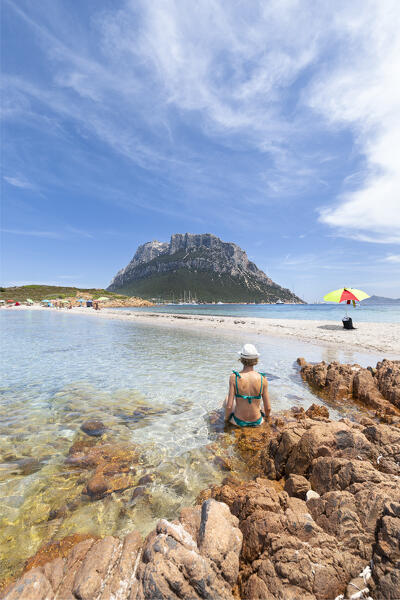 A girl in the Spalmatore di Terra beach on Spalmatore Cape on the Island of Tavolara (Olbia, Sassari province, Sardinia, Italy, Europe) (MR)