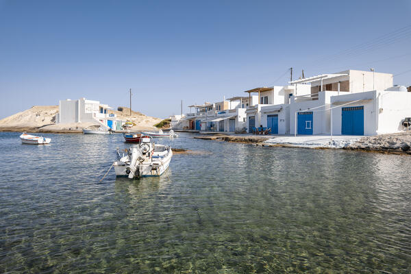 The small fishing village of Agios Konstantinos and its typical Syrmata (Plaka, Milos Island, Cyclades Islands, Greece, Europe)