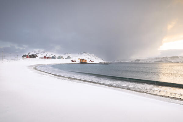 The village of Veines covered in snow during a winter sunrise (Kongsfjord, Varanger Peninsula, Troms og Finnmark, Norway)