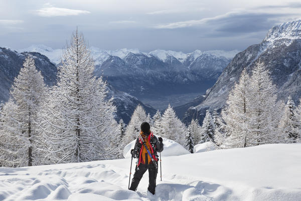 A girl is resting during the walk in Alp Astolo (Alp Astolo, Varzo, Verbano Cusio Ossola province, Piedmont, Italy, Europe)