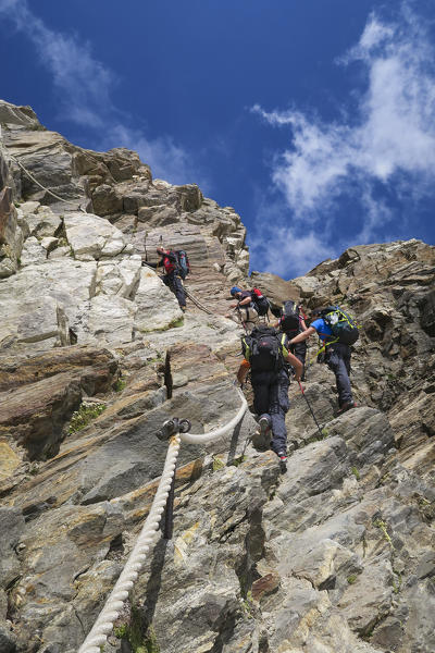 Mountaineers climb to the Gnifetti refuge in Monte Rosa Massif (Gressoney, Lys Valley; Aosta province, Aosta Valley, Italy, Europe)
