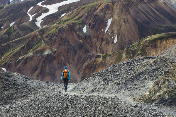 A trekker is walking to the summit of Blahnukur mountain (Landmannalaugar, Fjallabak Nature Reserve, Highlands, Southern Region, Iceland, Europe) (MR)