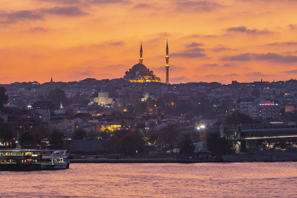 The Golden Horn river at sunset with a Mosque in the background. Istanbul, Turkey