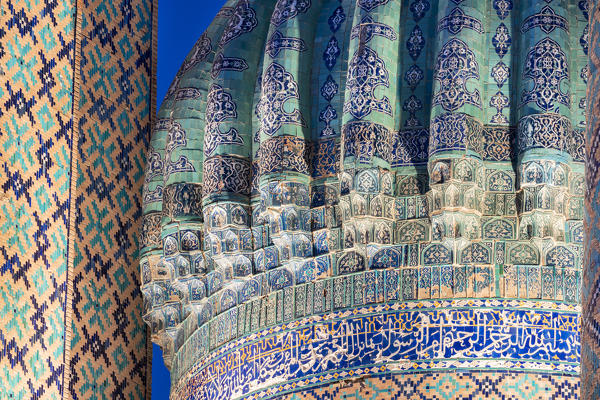 Close up of Sherdar, Cher Dor, Madrasah dome by night. Registan square, Samarkand, Uzbekistan, Central Asia.