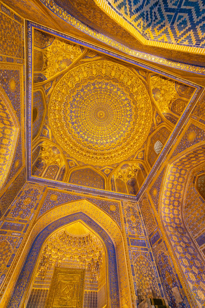 Gold gild in the interior mosque dome of Tilla Kari, Tilya Kori, madrasah. Registan square, Samarkand, Uzbekistan, Central Asia.