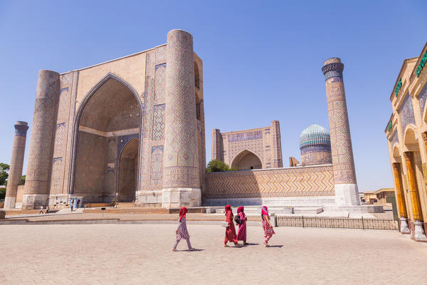 Uzbekistan people in front of Bibi Khanu Mosque in Sammarcanda. Samarkand, Uzbekistan, Central Asia.