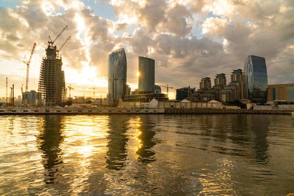 Baku Skyscrapers in the rich modern part of city in backlight. Baku, Azerbaijan, Central Asia.