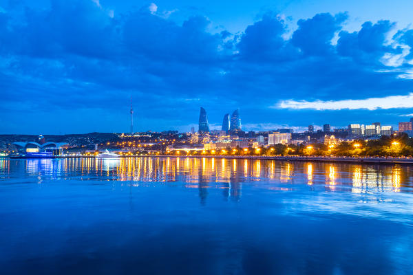 Baku Cityscape at twilight from Caspian seafront. Baku, Azerbaijan, Central Asia.