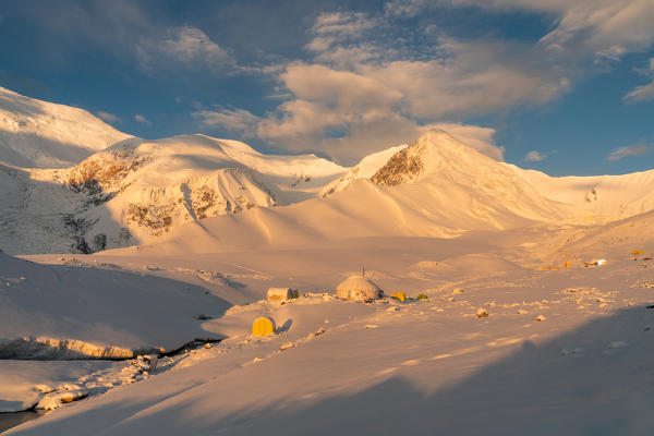 Landscape of Peak Lenin camp one with Peak Lenin massif in the background. Pamir, Kyrgyzstan, Central Asia. 
